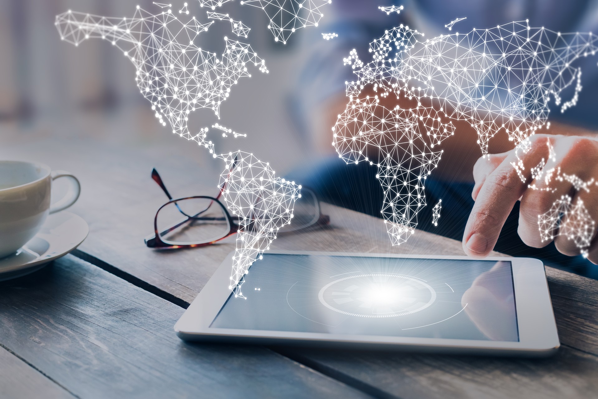 International business network with connected lines, worldwide communication for internet of things, finance, trading, blockchain and web technologies, concept wit businessman using tablet computer International business network with connected lines, worldwide communication for internet of things, finance, trading, blockchain and web technologies, concept wit businessman using tablet computer